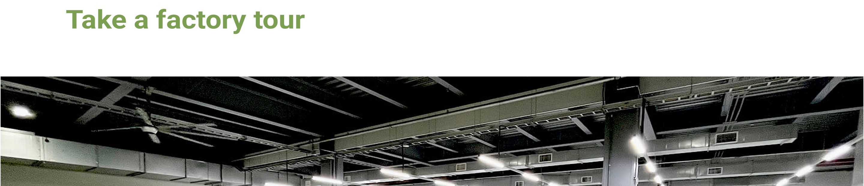 NTI factory floor — press hall lighting and overhead services