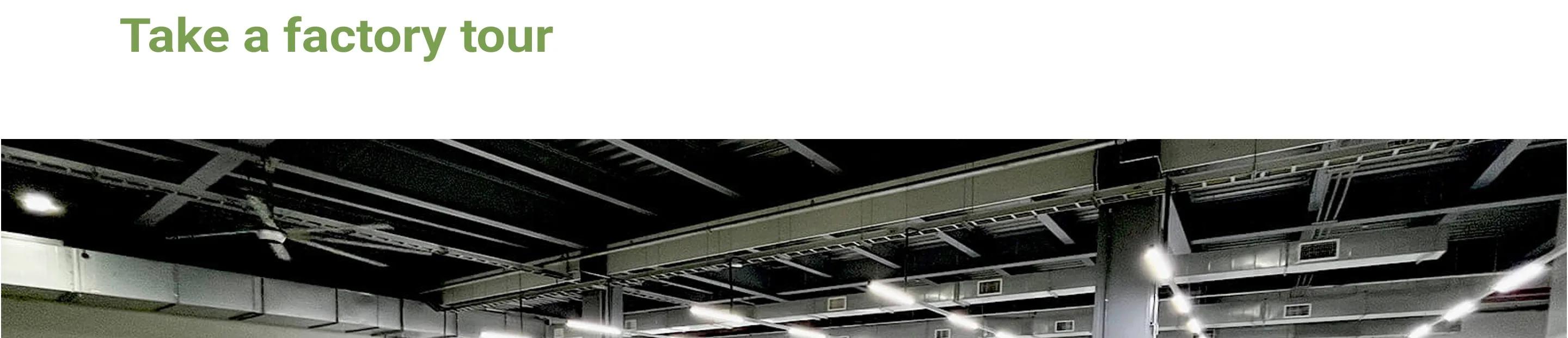 NTI factory floor — press hall lighting and overhead services